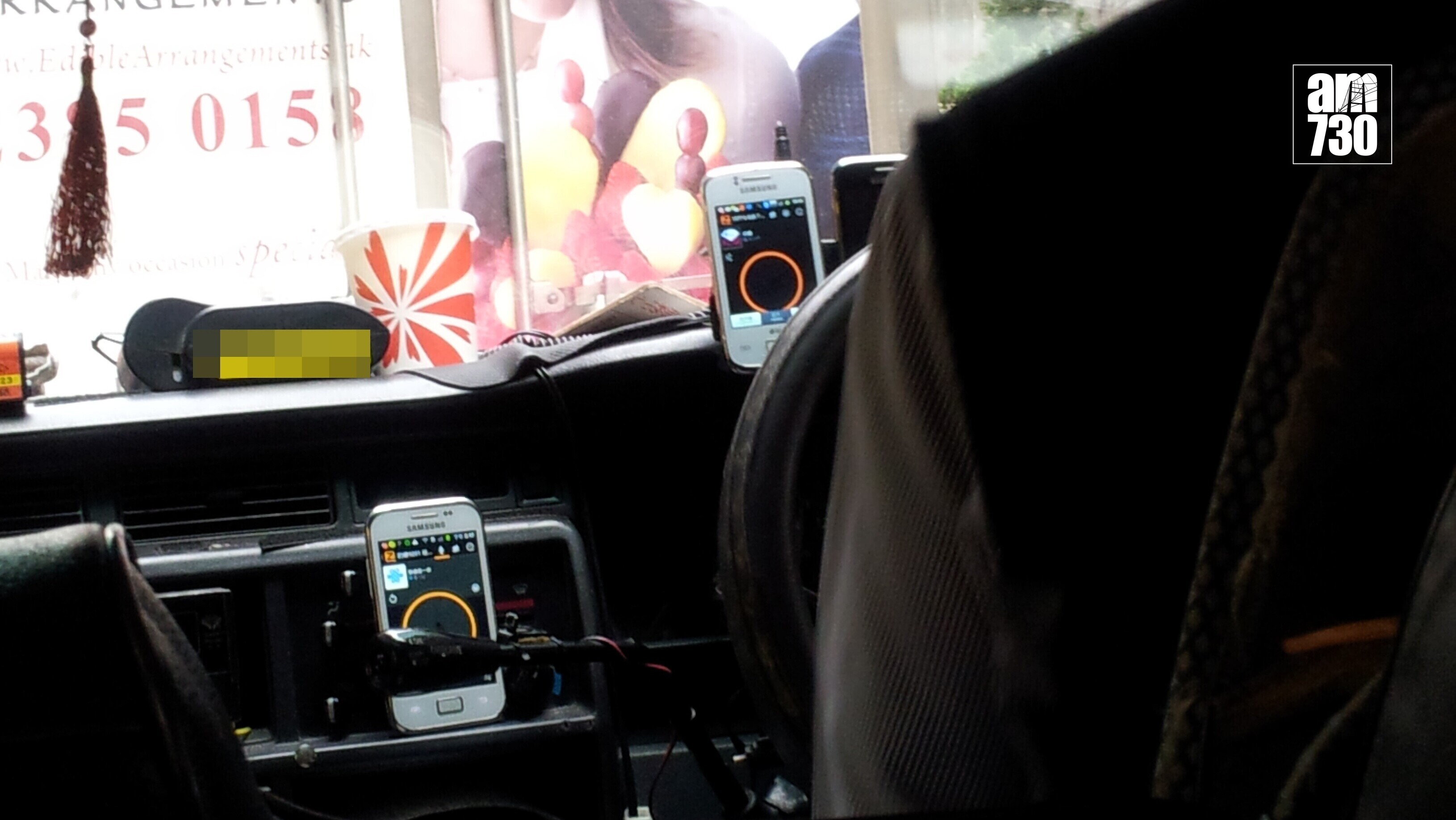 司機前方最多僅可放置兩部流動裝置新規例生效。(資料圖片)