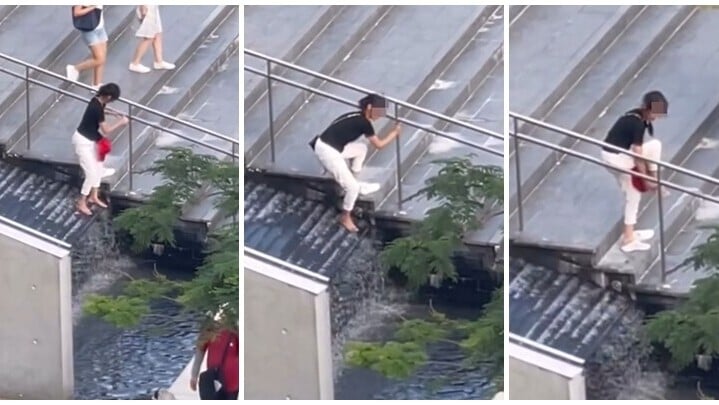 西九文化區的香港故宮博物館外圍一帶，一名女子爬過欄杆走進樓梯旁邊的水池洗腳。(Threads)