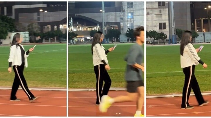 一名中年女子使用葵涌運動場跑道時，一邊看手機一邊「慢步」。(Threads)