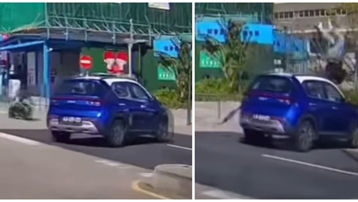 澳門協和醫院外一輛私家車右轉，一輛電單車高速駛至猛撞私家車，鐵騎士拋飛半空。(影片截圖)
