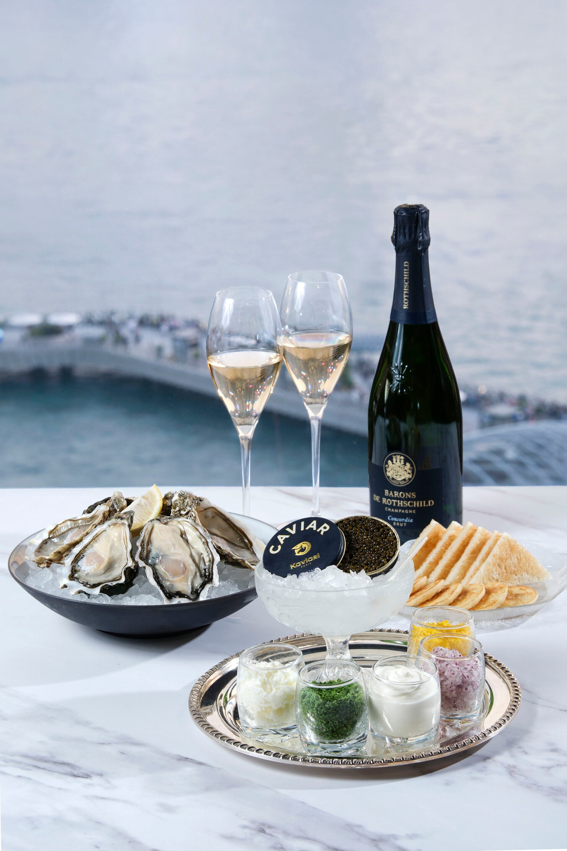 Fresh Shucked Oysters (left),Caviar Kaviari Oscietra (right)