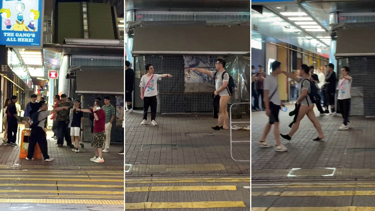 一名怪漢在旺角街頭與途人爭執，更一度脫下長褲和內褲。(網上影片截圖)