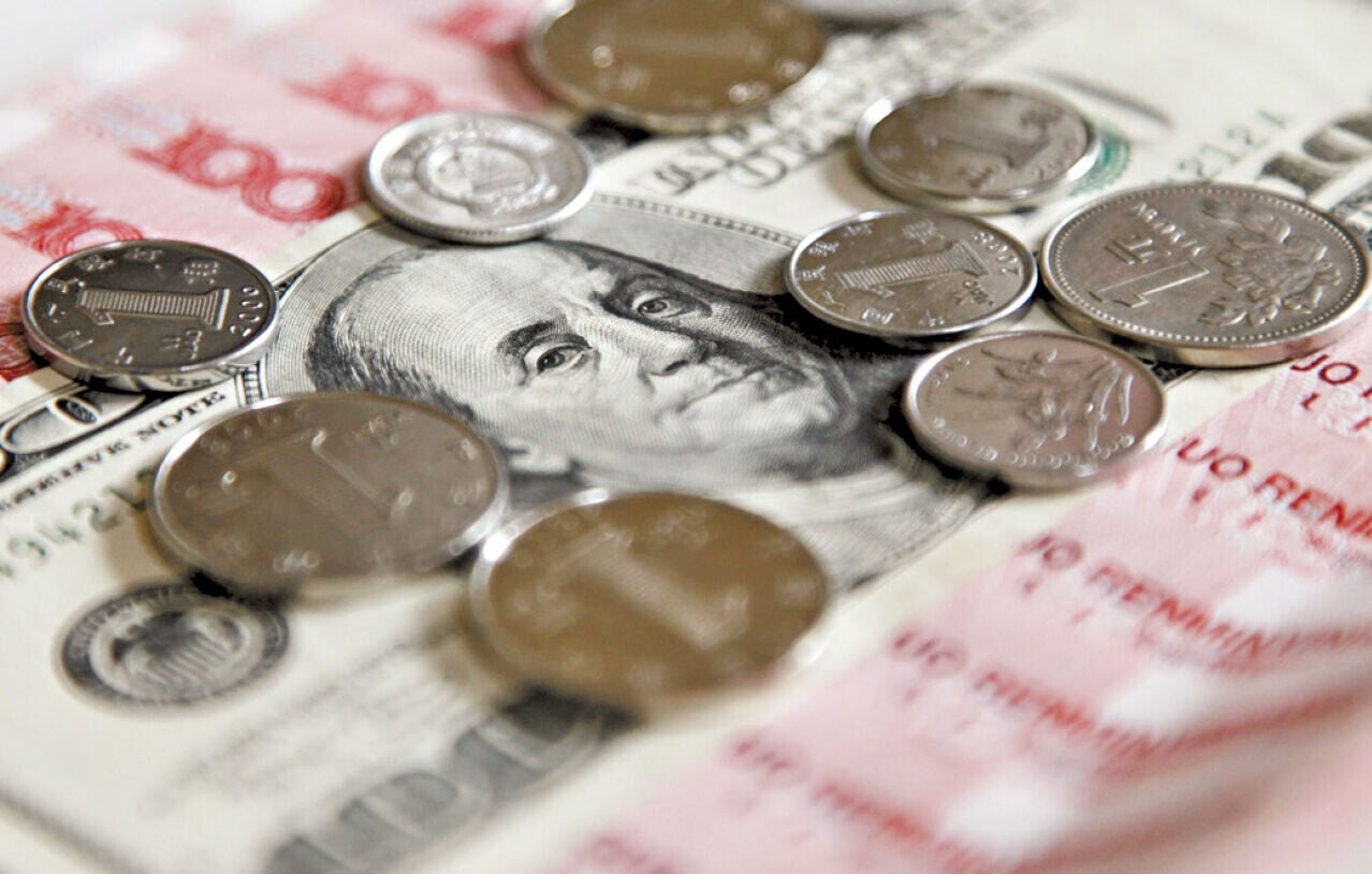 美匯指數曾回升至100以上，顯示資金重新回流美元資產。(資料圖片)