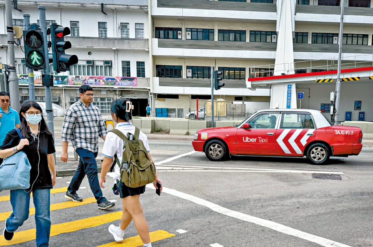 規管網約車，有助市民大眾有更多出行交通工具選擇。(中通社)