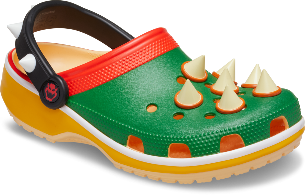 Bowser Classic Clog: 鞋面嵌有象徵庫巴龜殼的尖刺設計,並還原經典配色組合:亮眼的綠色鞋面、橙紅色的邊緣點綴,以及醒目的黃色鞋底。每一步都散發出無人能擋的王者風範!