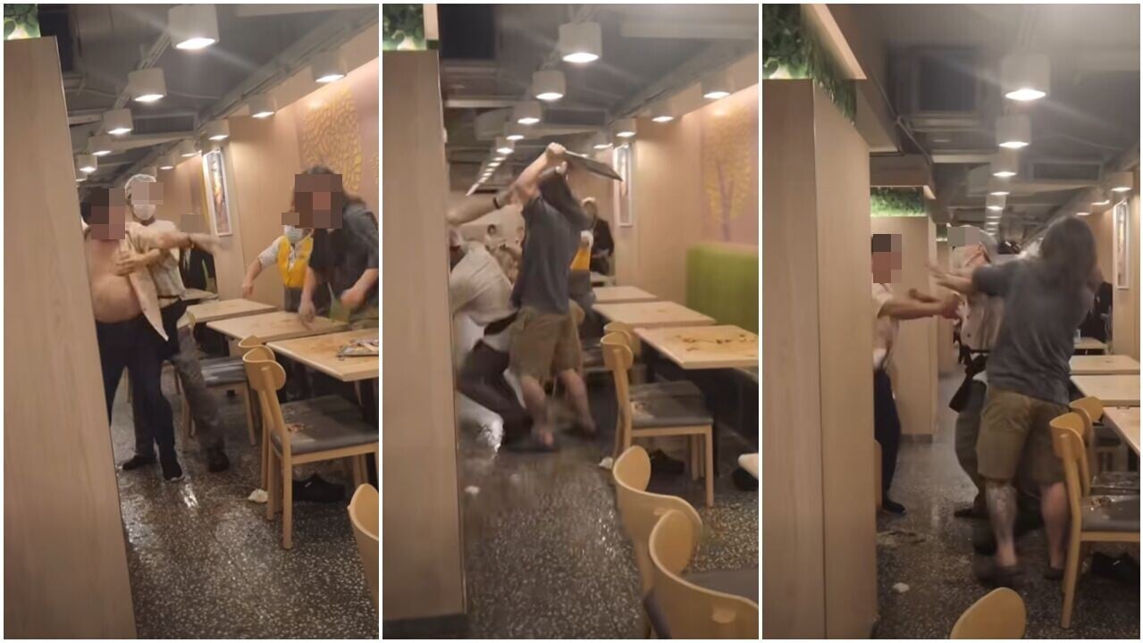 網傳影片，可見在大家樂分店內，兩名男女職員極力勸阻兩男子打架。(FB@香港交通及突發事故報料區)