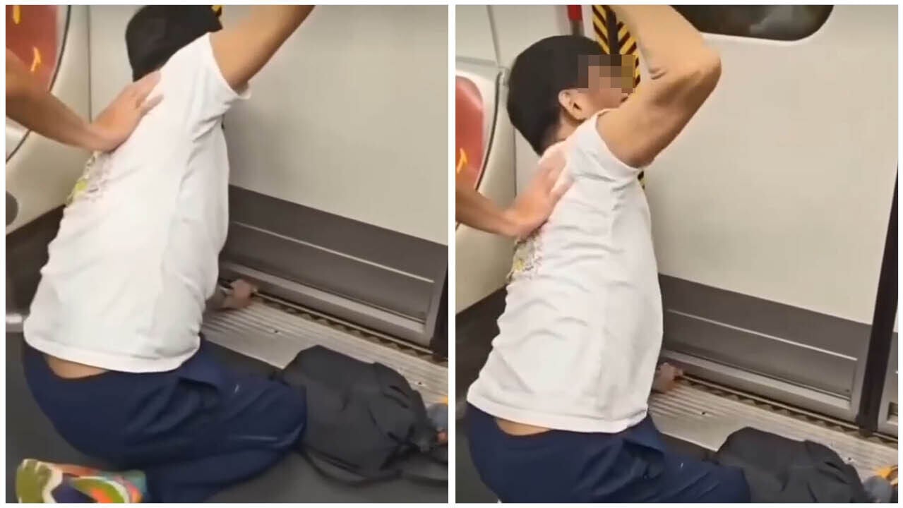 一名港鐵男乘客疑因嘗試自行執拾跌落路軌的物品，而遭列車車門夾住左手，狀甚痛苦。(網上影片截圖)