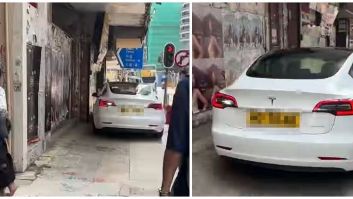 一輛Tesla電動車沿灣仔菲林明道30號外的行人路上倒車(Threads)