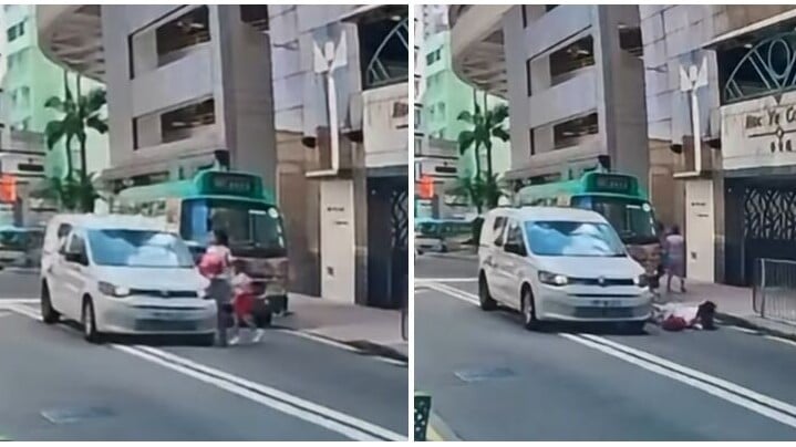 車Cam直擊︱羅便臣道一名45歲婦人與5歲女兒落小巴後橫過馬路時，一輛客貨車涉在雙白線爬頭越過小巴前行，結果將母女撞倒。（影片截圖）