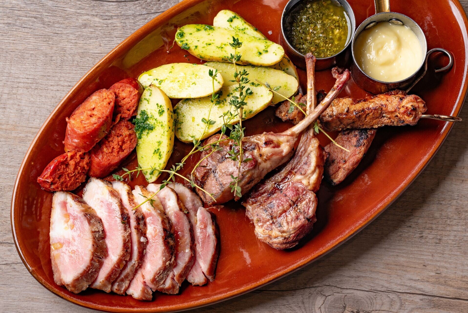 MAIN Parrillada de Carne Mixed grill or lamb chops, pork pluma, chorizo & skewers with patata caliu & alioli 1