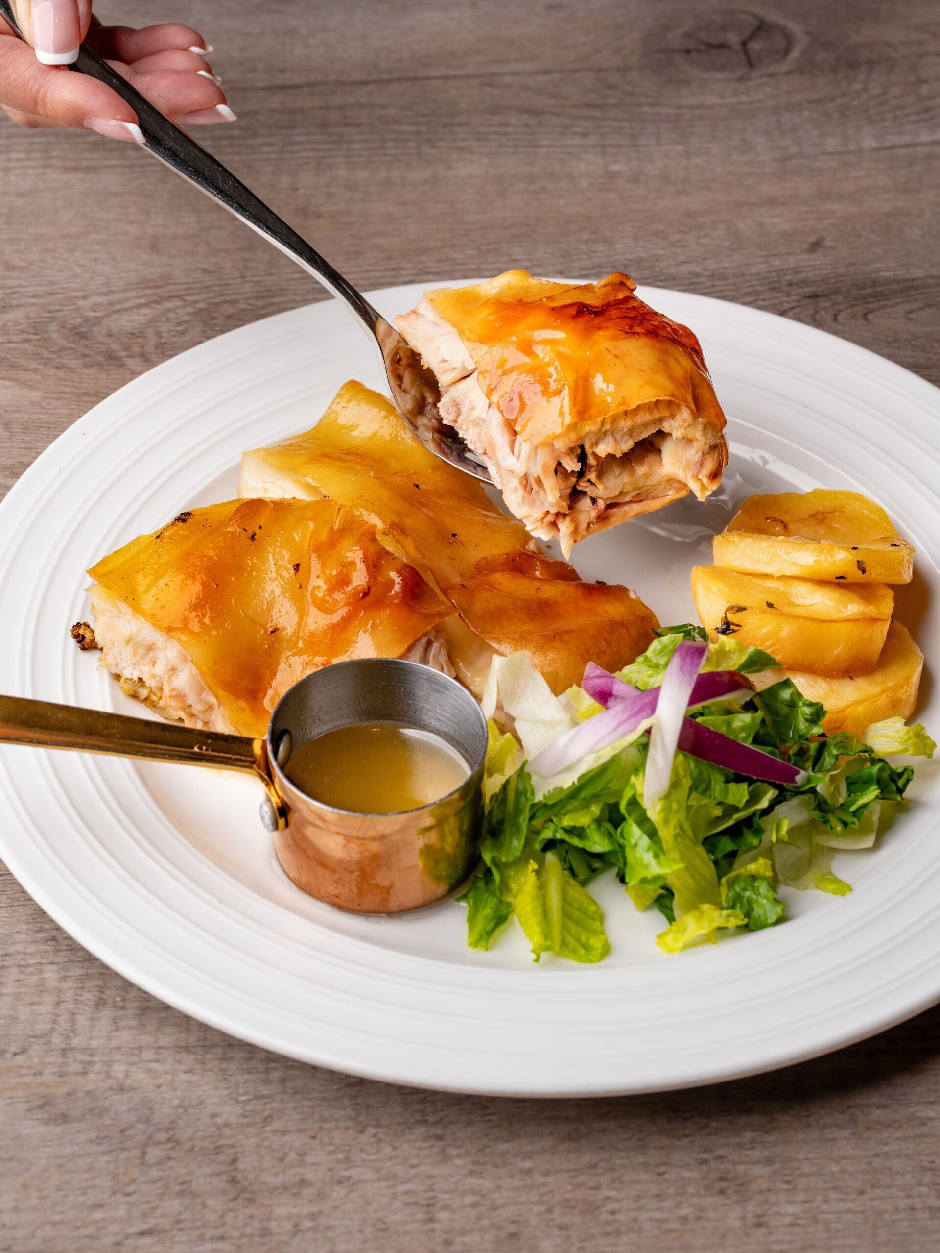 MAIN Cochinillo Asado Estilo Segovia Olé's signature crispy roasted suckling pig served with a fresh salad 2