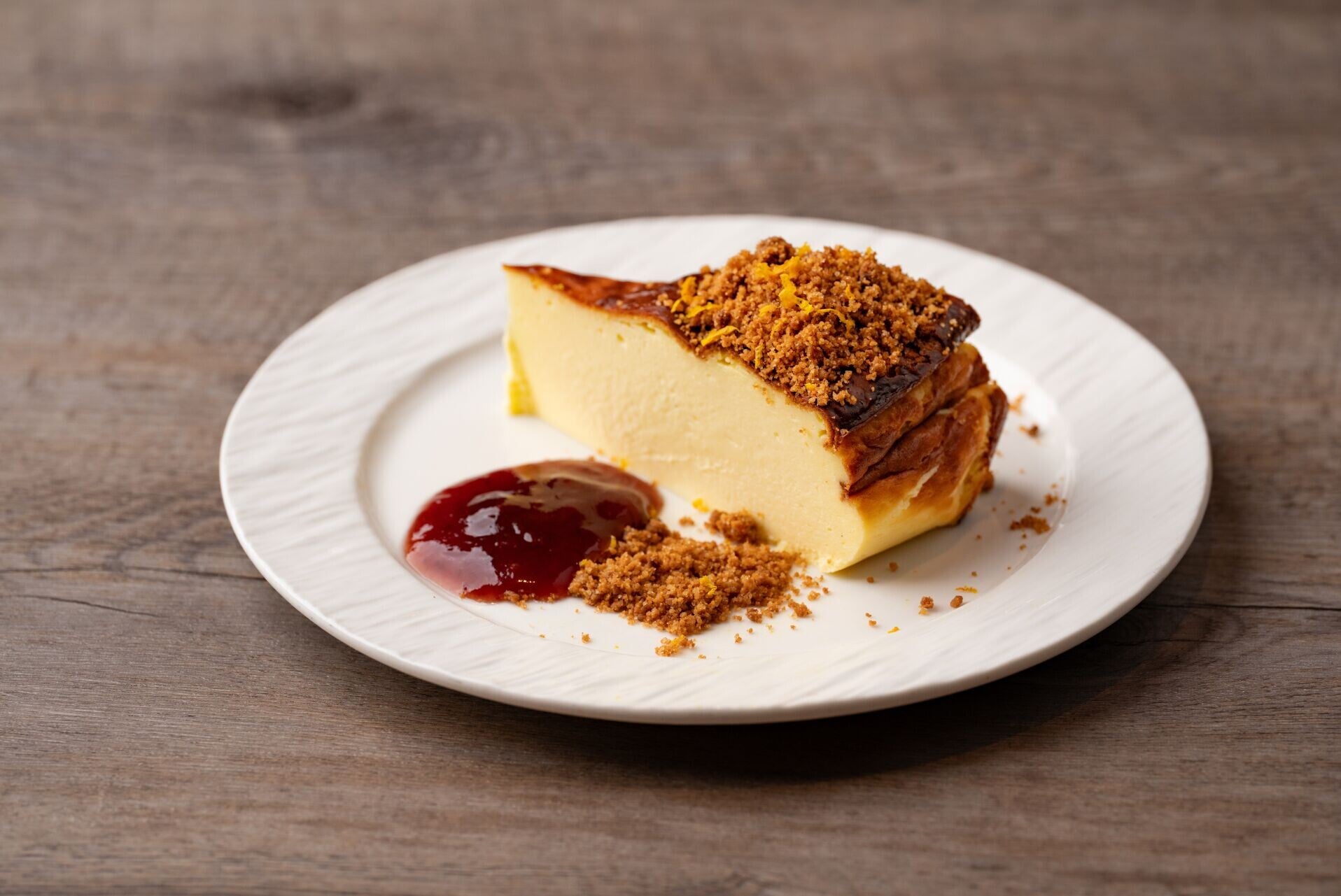 DESSERT Tarta de Queso Vasca Velvety burnt Busque cheesecake with orange zest & red fruit jam 1