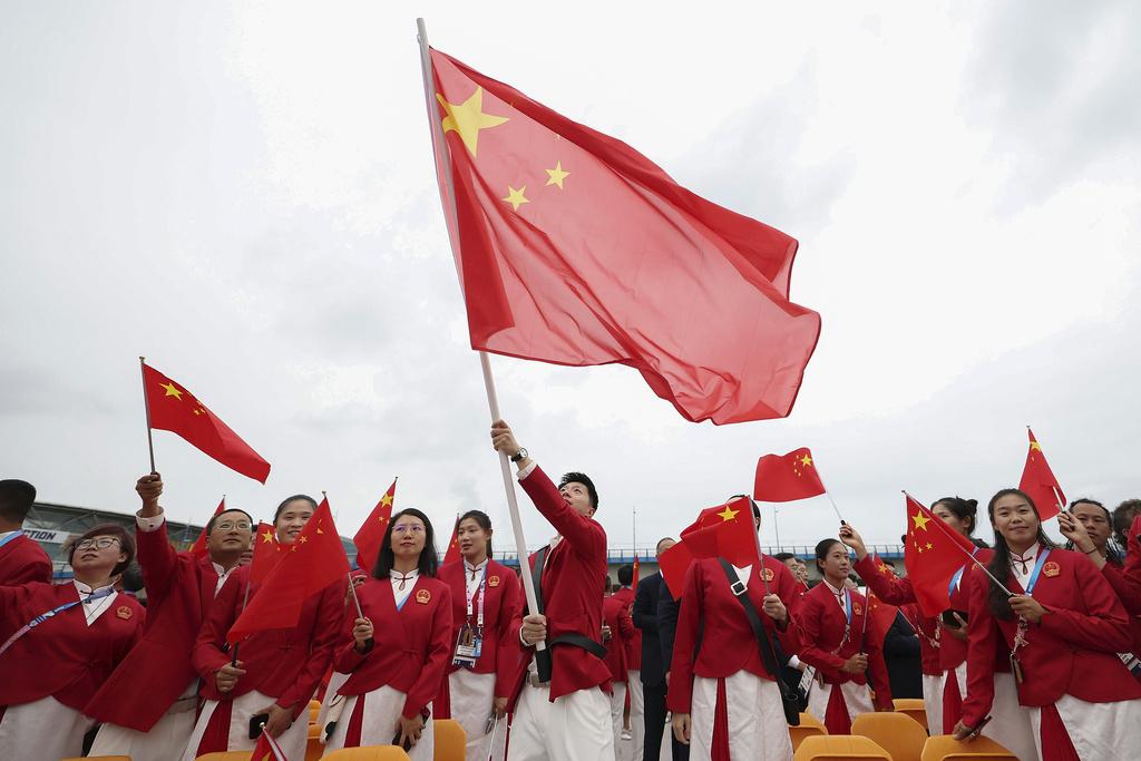 國家隊聲勢繼續浩瀚,於開幕禮與加拿大同船。(新華社)