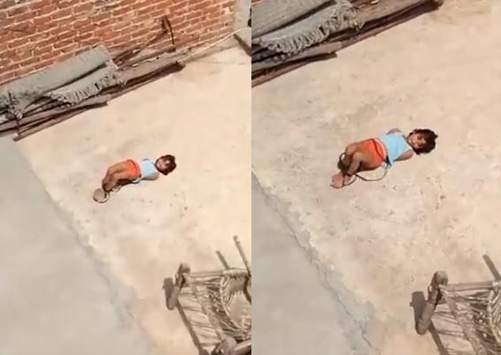 女童雙手反綁，在天台被曬得翻來覆去。(互聯網)