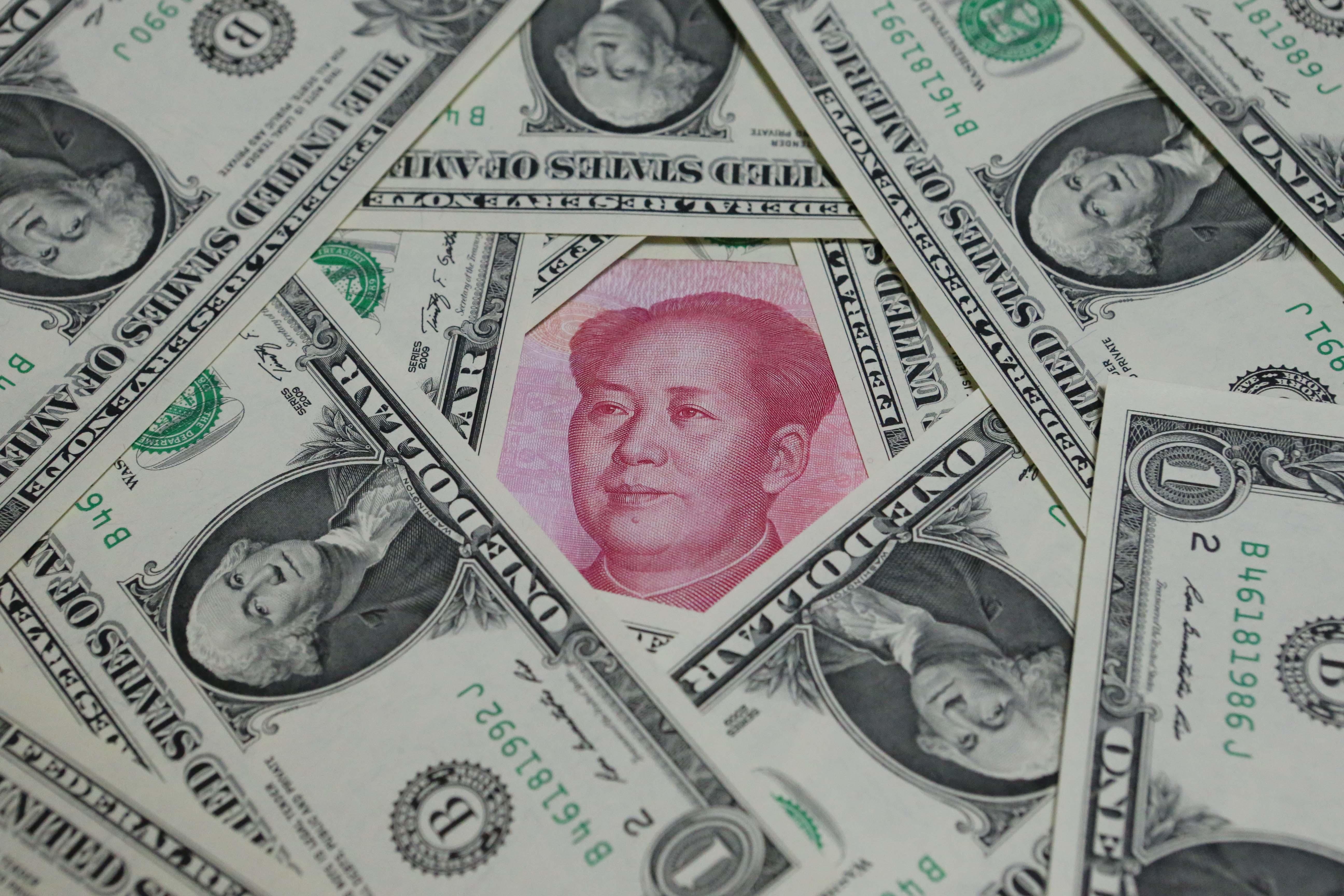 人民幣兌美元中間價下調83點子  創28個月新低