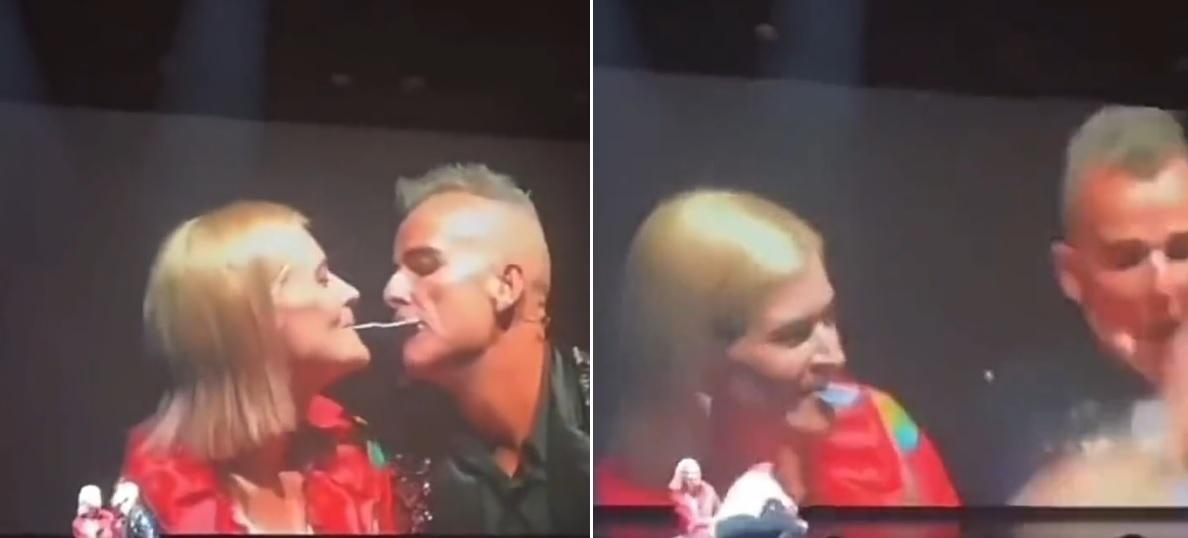 墨菲與女觀眾叼著啤牌調情，男子眼火爆，衝上台將墨菲推倒。(互聯網)