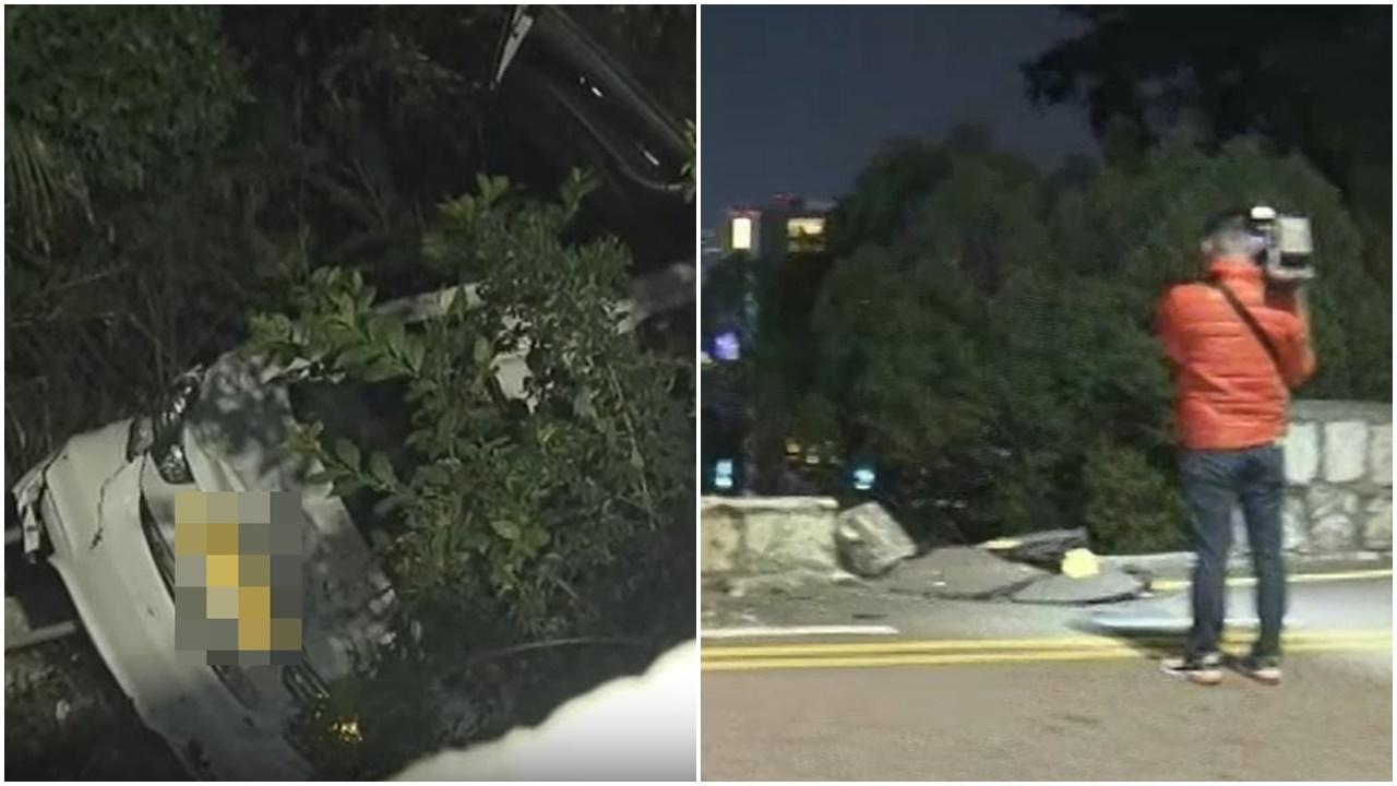 司徒拔道寶馬越線撼私家車撞破石壆墮山坡，3人受傷送院。(電視截圖)