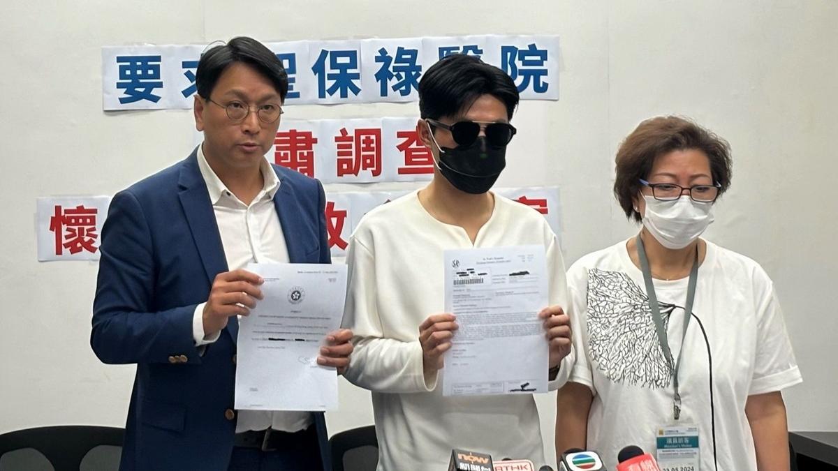 死者陳先生的兒子(中)和遺孀(右)質疑醫院疏忽；左為鄧家彪。(林嘉瑩攝)