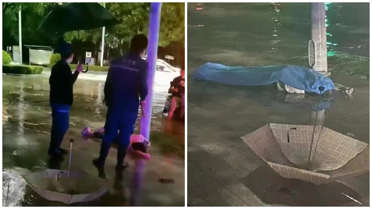 河南漢水浸過路疑被路燈漏電電死，救護員到場唔敢埋身。(X)