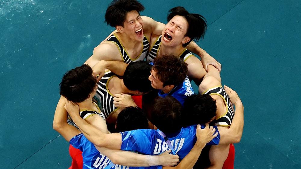 日本體操隊在最後反勝中國奪標。(路透社)