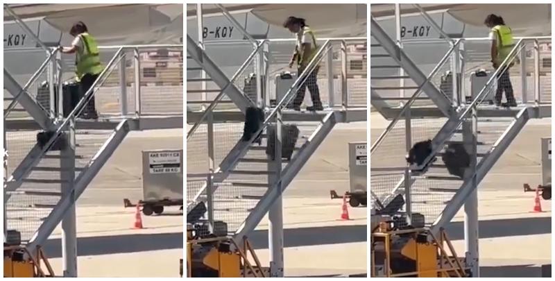 有影片顯示國泰航空的一名員工在機場多次從樓梯上把行李箱扔下(影片截圖)