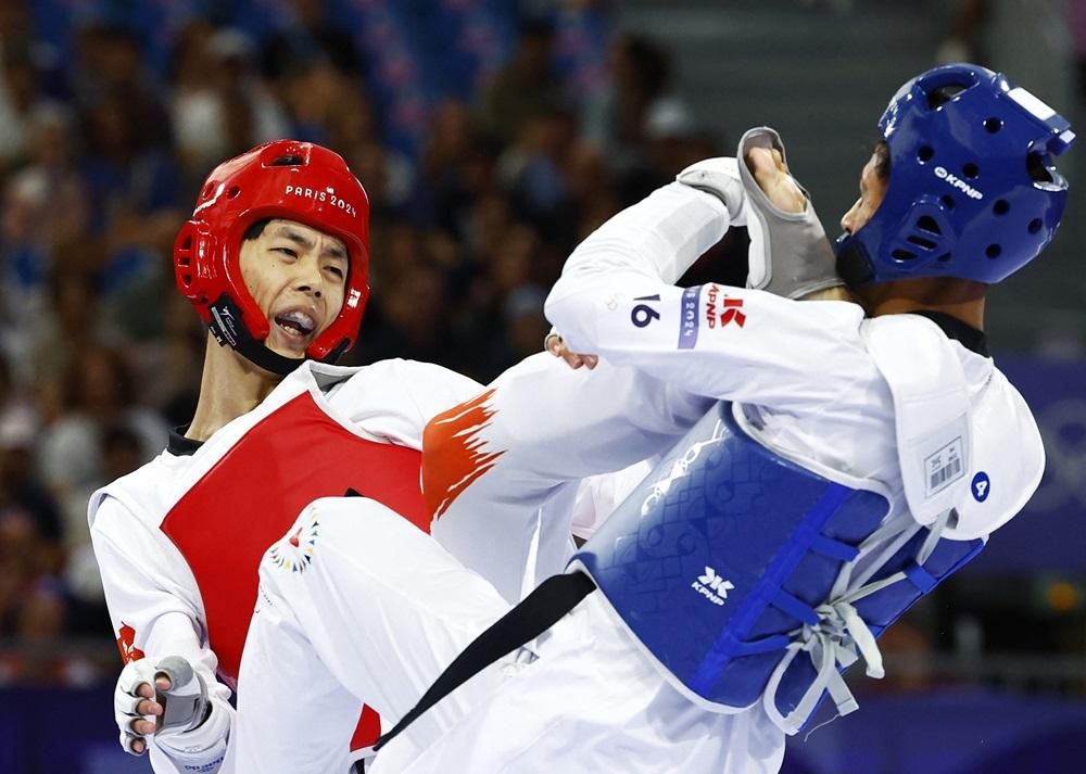 香港跆拳道代表盧蔚豐，對手是難民代表團的代表。(路透社)
