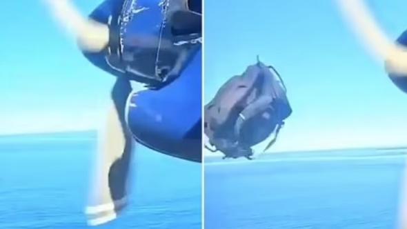 飛機飛飛下，突然跌出行李，更擊中螺旋槳。(互聯網)