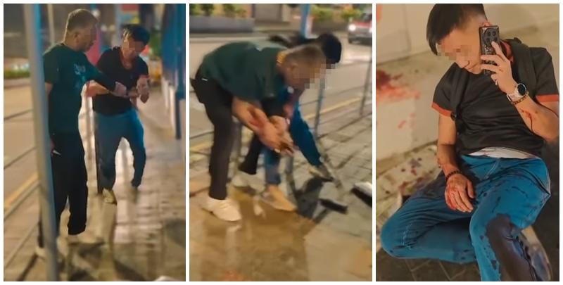 休班PTU警長彌敦道街頭遭搶銀包，與一名南亞裔持刀男子糾纏時被襲擊致手腳浴血，事後臥地打電話求助(影片截圖)