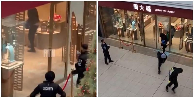 多倫多周大福遭6名劫匪搶走大量金飾珠寶，事發時有商場保安員在周大福門外眼白白看6名劫匪逃離現場，僅拍片取證沒有阻止。(影片截圖)