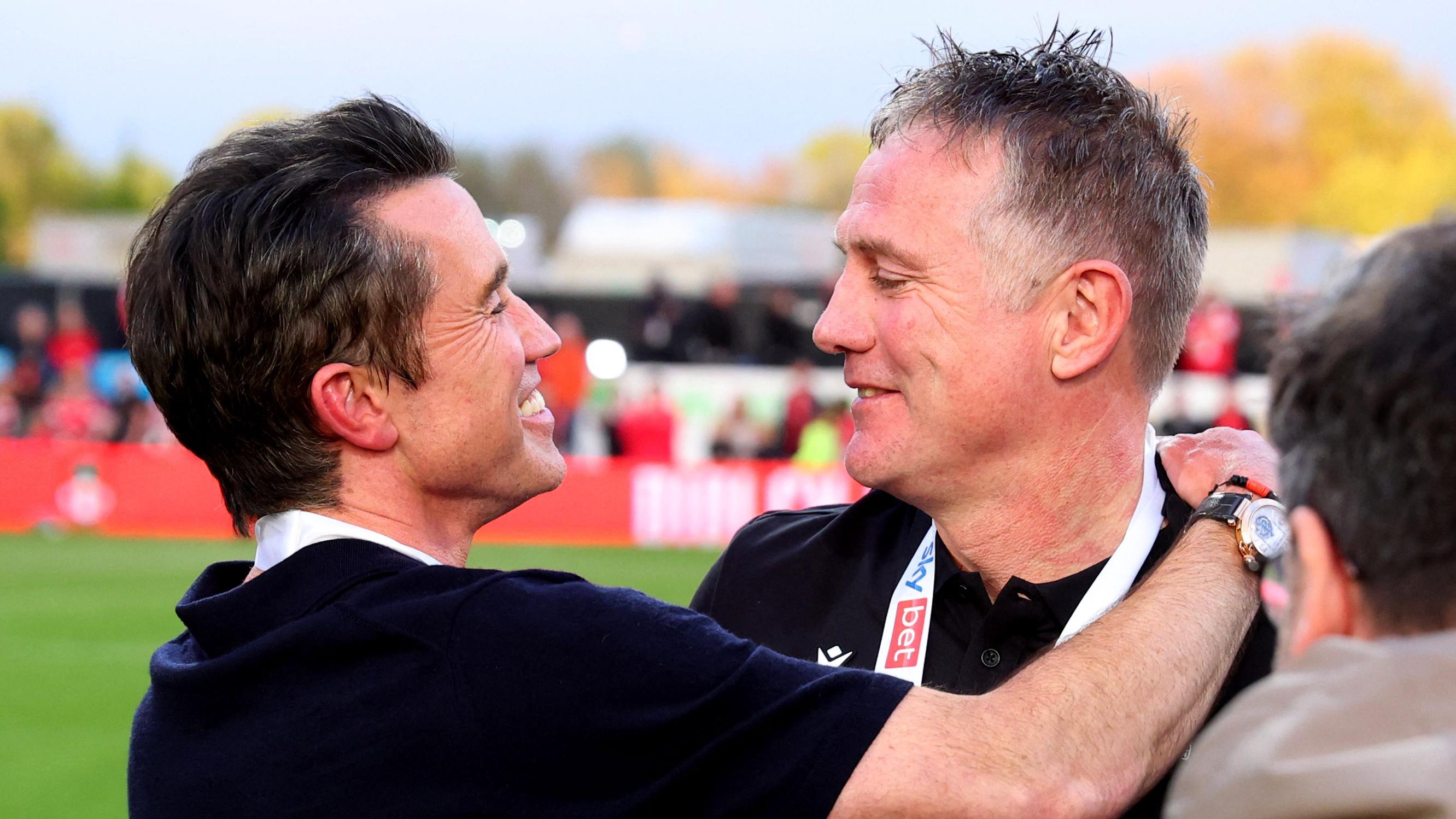 域斯咸班主之一的麥艾漢尼與主帥柏堅遜。(路透社)