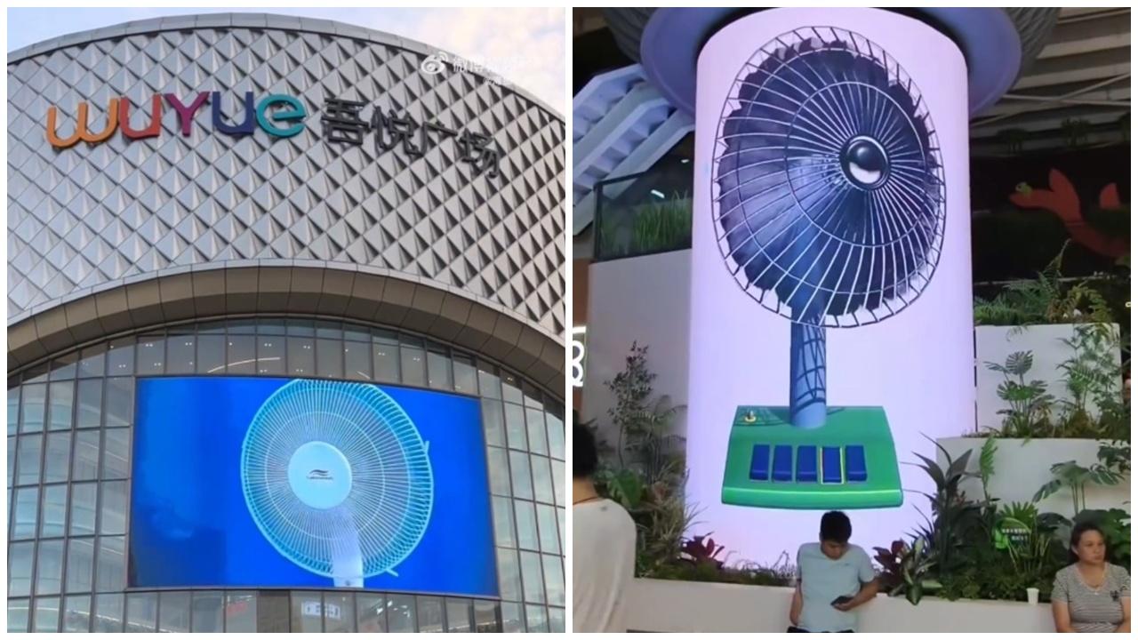 內地商場大屏幕播風扇，給路人心理安慰「望扇止暑」。(微博)