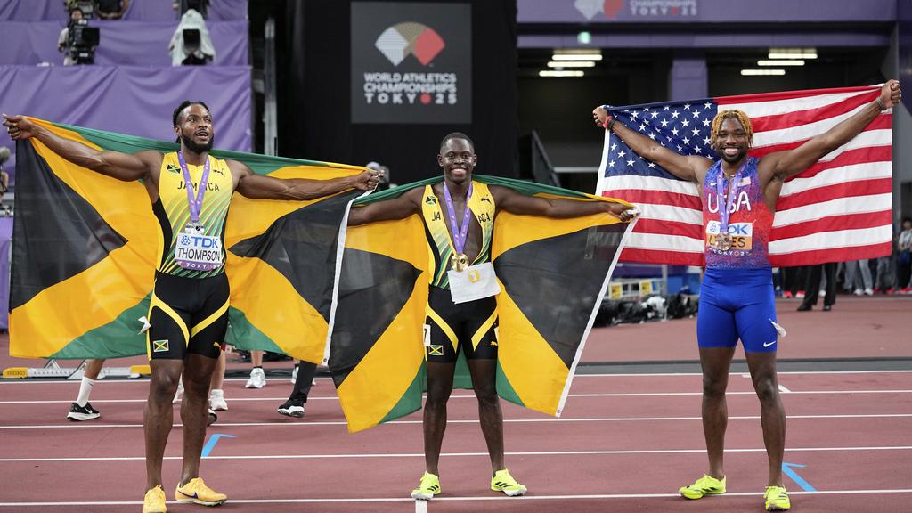 施維爾與基辛湯遜在世錦賽男子100米奪得冠亞軍。(美聯社)
