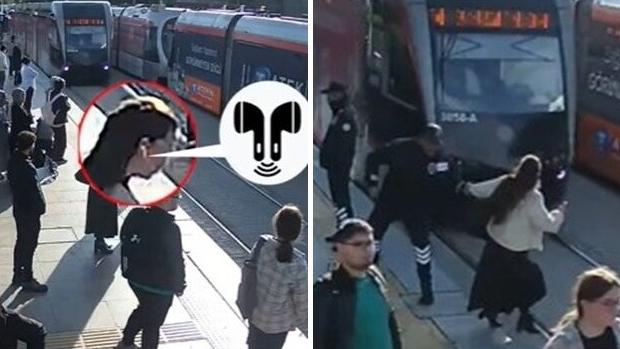 女子戴著耳機，沒察覺電車駛至，所幸車站保安員及時伸手把她拉回路邊。(互聯網)