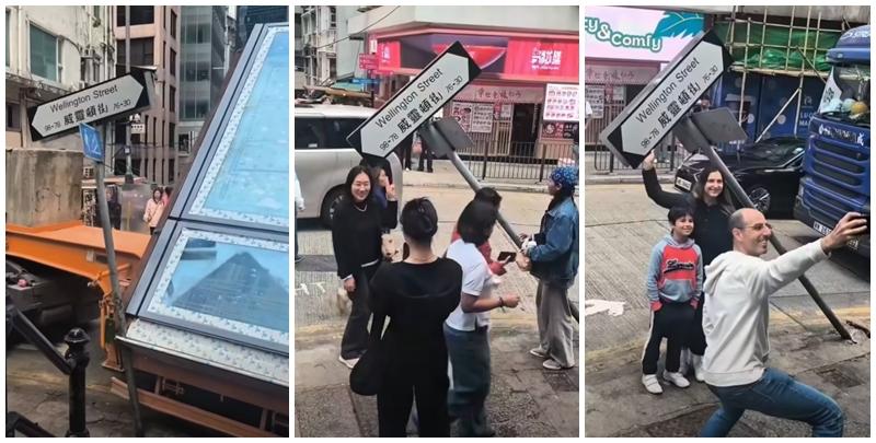 一輛載有玻璃窗等大型建築材料的大型貨車，撞到「威靈頓街」路牌。路牌被撞後傾斜近45度角，最後貨車離開現場，事後引來不少市民及遊客圍觀擺甫士「打卡」拍照。(SH Hong@車cam L（香港群組）FB)