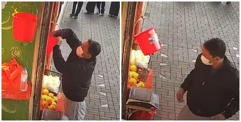 上水龍琛路一間生果店險遭賊人光顧，一名戴口罩男子趁店員不在，企圖偷去掛在店舖近門口處錢兜內的鈔票。幸店主早設「機關」用夾子夾住鈔票，再用繩繫住夾子與錢兜，令賊人無功而返。(影片截圖)